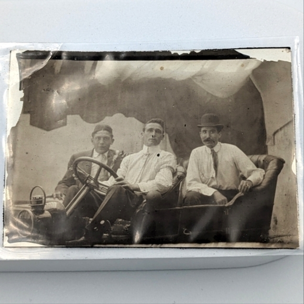 Antique genuine photograph of three men in an automobile